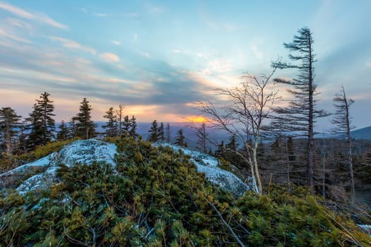 Sunset on the Tukuringra ridge. Beautiful winter sunset on the top of the mountain.