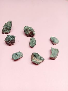 Black Colored Stone Stock on Pink Background