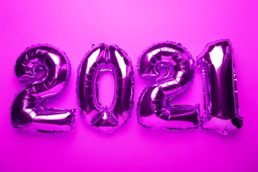 2021 concept new year from purple pink foil balloon stock photo