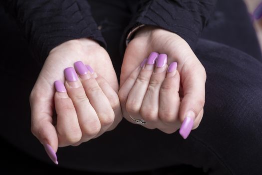 Overgrown manicure. Female hands with overgrown nails. Time for correction gel polish. nail care concept stock photo