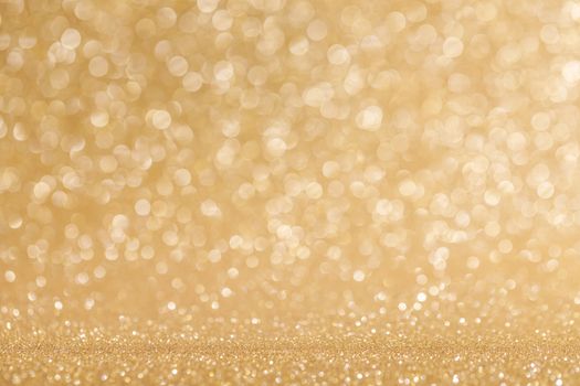 Shiny golden bokeh glitter lights abstract background, Christmas New Year luxury party celebration concept