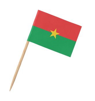 Small paper flag of Burkina Faso on wooden stick, isolated on white
