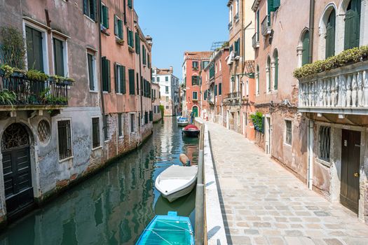 Small channel in the old town of Venice, Italy