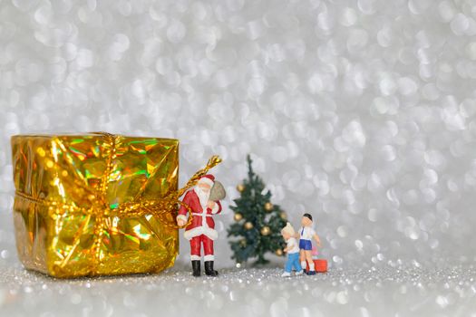 Miniature people, Happy family celebrating A Christmas  , Christmas and Happy New Year concept.