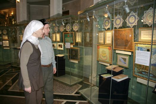 muslim couple walks the islamic museum in the mosque.