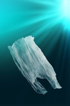 creative background of single-use plastic bag floating in sea or ocean, most plastic bags end up in landfill or in ocean, polyethylene plastic, pollution concept, pollution of environment