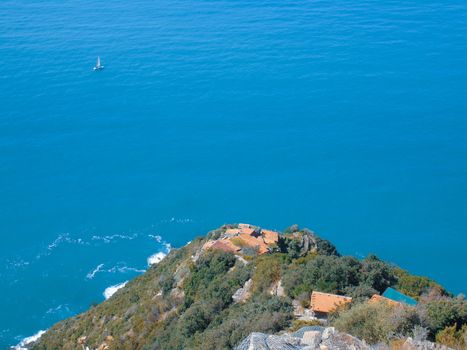 Liguria, Italy - 06/15/2020: Travelling around the ligurian seaside in summer days with beautiful view to the famous places. An amazing caption of the water and the sky reflection with blue sky.