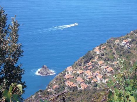 Liguria, Italy - 06/15/2020: Travelling around the ligurian seaside in summer days with beautiful view to the famous places. An amazing caption of the water and the sky reflection with blue sky.