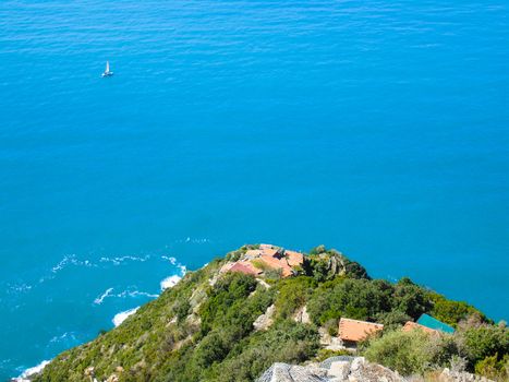 Liguria, Italy - 06/15/2020: Travelling around the ligurian seaside in summer days with beautiful view to the famous places. An amazing caption of the water and the sky reflection with blue sky.