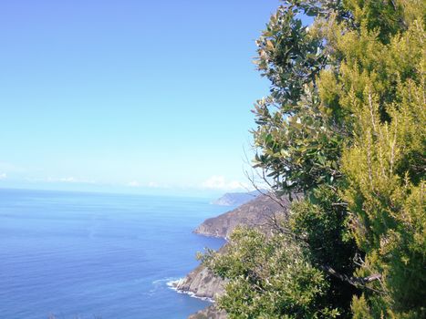 Liguria, Italy - 06/15/2020: Travelling around the ligurian seaside in summer days with beautiful view to the famous places. An amazing caption of the water and the sky reflection with blue sky.