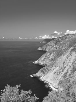 Liguria, Italy - 06/15/2020: Travelling around the ligurian seaside in summer days with beautiful view to the famous places. An amazing caption of the water and the sky reflection with blue sky.