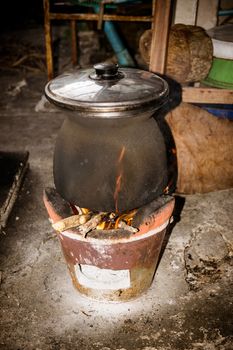 Antique old stove with a pot.