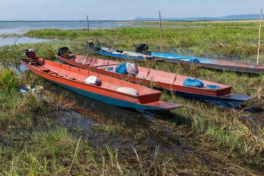 Long-tail boats moored near the river