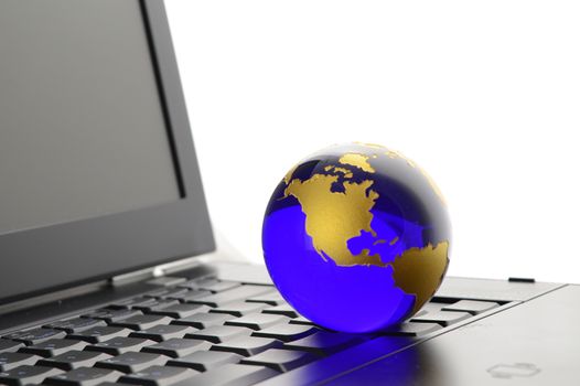 A conceptual image of a globe of Earth with a laptop for networking ideas.