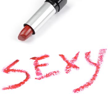 A seducing red lipstick written word sexy.