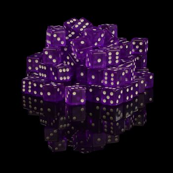 A heaping pile of new unused casino grade dice with a black reflective surface background.