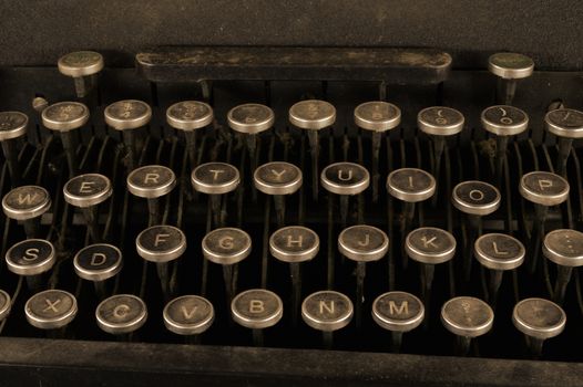 A closeup of an antique typewriter keyboard.