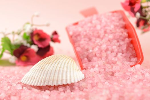 A scoop of cleansing pink bath salts to add to your hygiene routine.