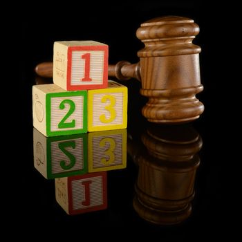 A gavel and numbered blocks represent the fundamental basics of the legal system.