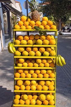 Oranges, pineapples and bananas for sale in the street