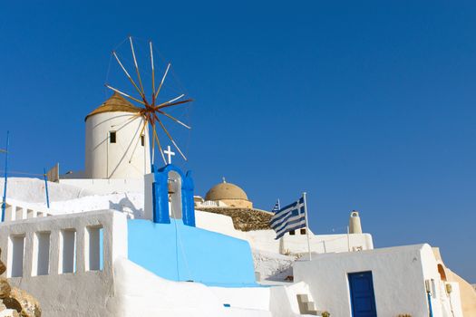 Typical greek style windmill in Oia, Santorini,