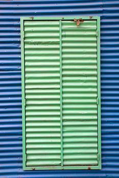 Blue wall with green window in La Boca, Buenos Aires