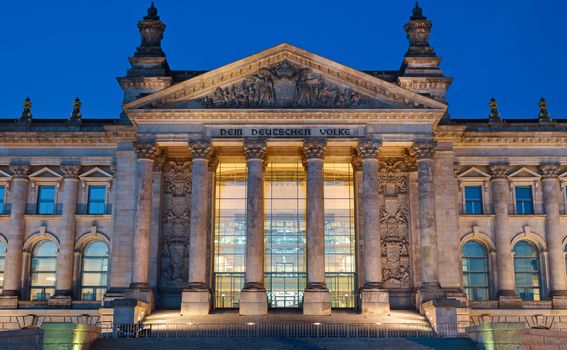 The entrance portal to the Reichstag in Berlin at night