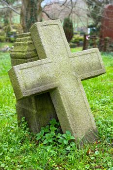 Old stone cross on a historic cemetary