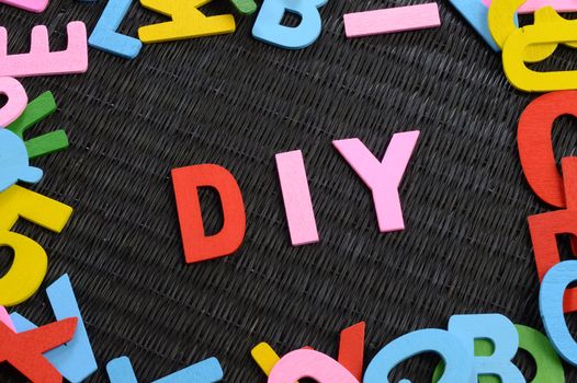 A closeup view of the acronym DIY for asserting the many Do It Yourself projects.