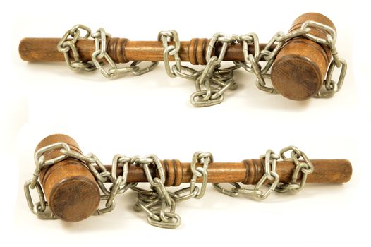 A couple of chain wrapped gavels for representing legal binding laws and policy in business.