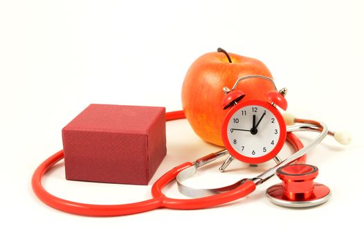 A red gift in a scene of healthcare items for various concepts.