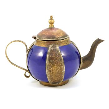 An isolated over white image of an antique tea pot from the early 1900s.