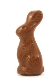 A solid milk chocolate Easter Bunny isolated over a white background.