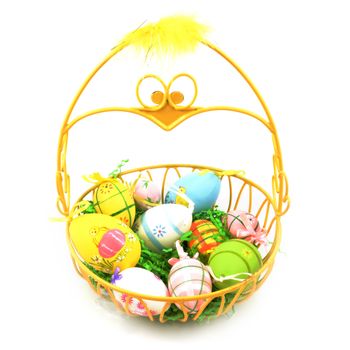 An isolated over white background image of an Easter basket that resembles a yellow chick which is full of painted eggs for the holiday season.