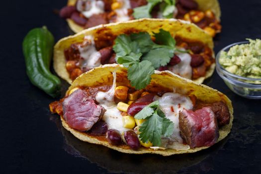 baked tacos on black slate