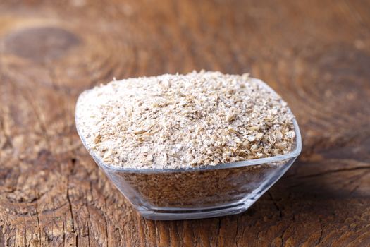 fresh barley malt on wood