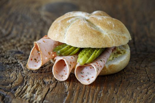 bavarian bun with sausage on wood