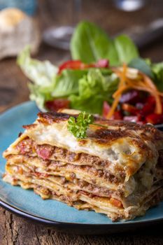 portion of fresh lasagna on a plate