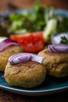 closeup of falafel with onions