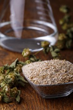 fresh barley malt on wood