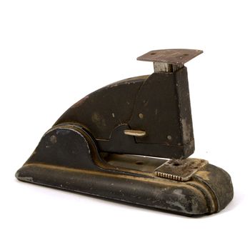 An isolated over white image of an antique stapler.