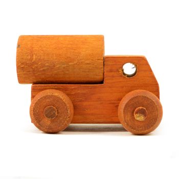 An isolated over white background side view of a wood toy truck.