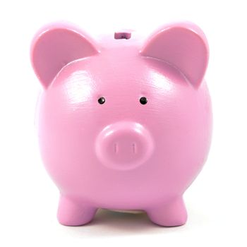 An isolated image of a pink coin piggy bank over a white background.