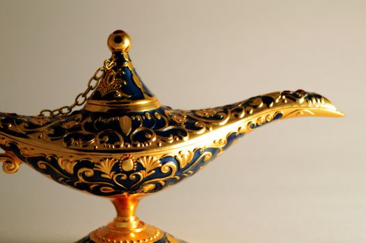 A closeup image of a magical genie lamp representing the wealth of wish fullfillment.