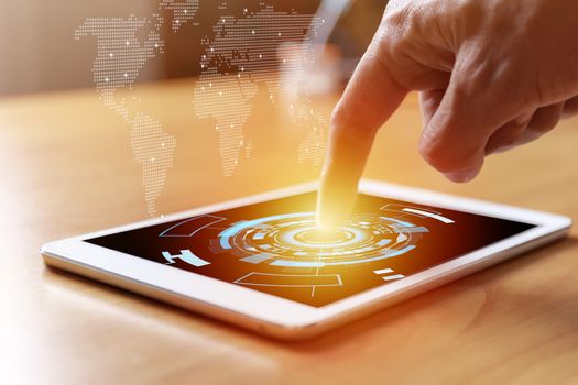 Business and social network concept. Businessman hands with tablet and world map tree graph background. Businessman hands use tablet network contact with customer and partners all the word.