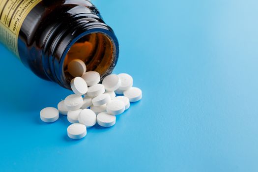 zinc tables, nutrition supplement pills on blue background