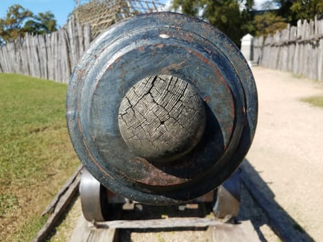 iron metal cannon weapon plugged with wood sphere