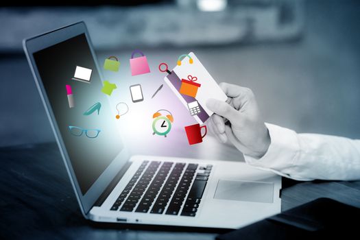 Beautiful young asian woman holding a credit card and shopping online with using laptop computer at cafe on blue tone, girl payment on internet, business ecommerce icon concept.