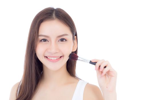 Beauty asian woman applying make up with brush of cheek isolated on white background, beautiful of girl holding blusher, skincare and cosmetic concept.