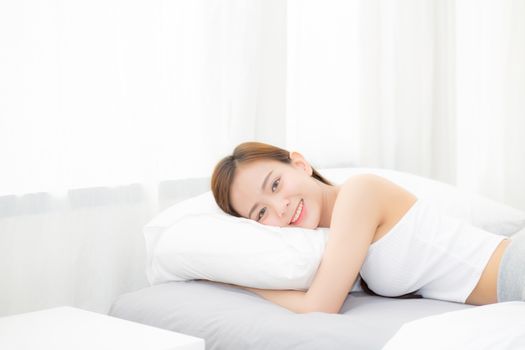 Portrait of beautiful asian young woman sleep lying in bed with head on pillow comfortable and happy with leisure, girl with relax  for health and lifestyle concept.